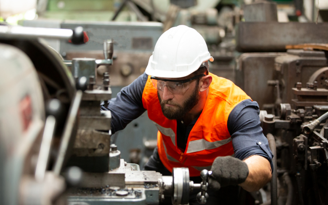 A specialty grinder operates a machine in a manufacturing setting